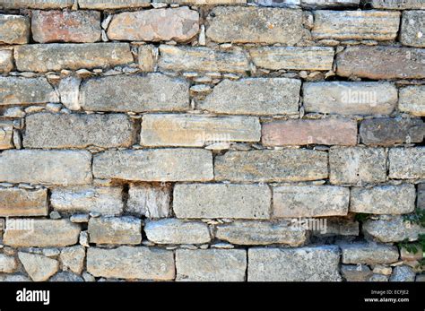 Stone brick wall background Stock Photo - Alamy