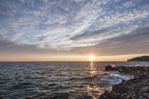 Black Rock Beside the Sea Under the Sunset · Free Stock Photo