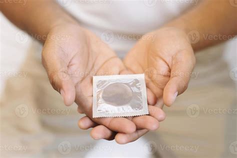 Condom Ready To Use In Male Hand Give Condom Safe Sex Concept On The