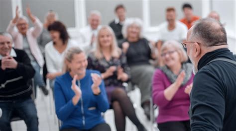 Premium Photo Mature Caucasian Man Gives A Speech In Meeting In