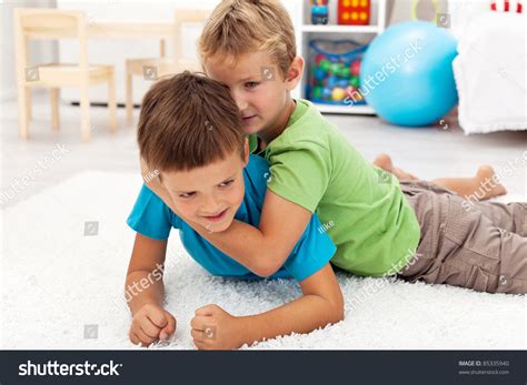 Kids Wrestling Playing On Floor Home Stock Photo 85335940 | Shutterstock