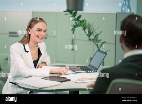 Smiling Professional Hr Agent Making A Job Interview To A Applicant In