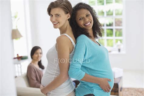 Pregnant Women Smiling Together Hope Multi Ethnic Group Stock