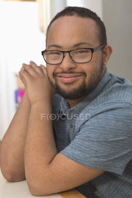 Portrait Of Happy African American Man With Down Syndrome At Home Fun