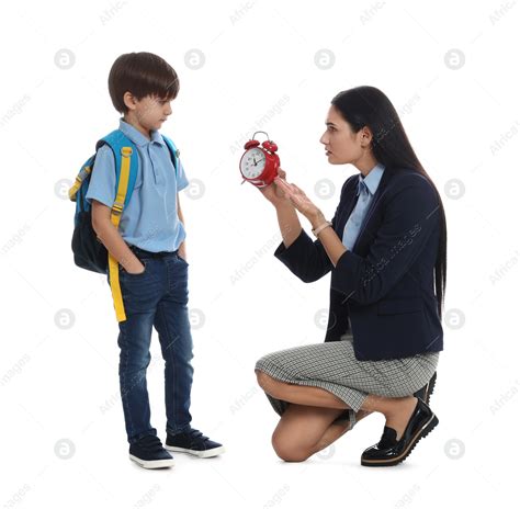 Teacher With Alarm Clock Scolding Pupil For Being Late Against White