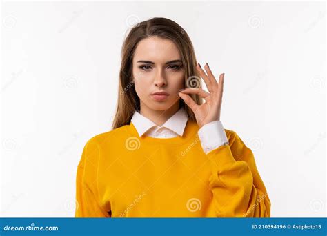 Brunette Girl Is Showing Zip Gesture As If Shutting Mouth On Key