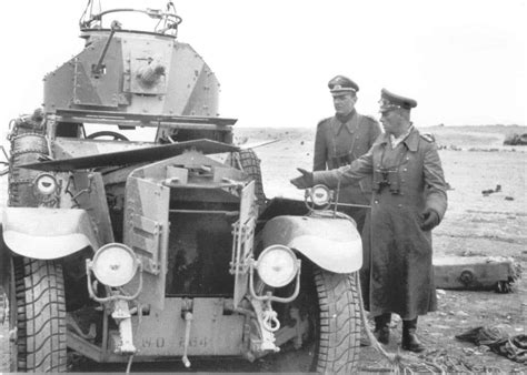 General Erwin Rommel Accompanied By An Officer Examines A Captured