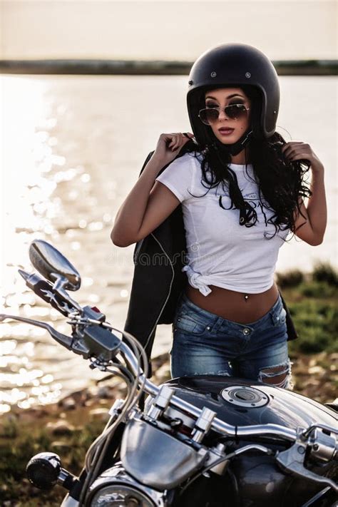 Beautiful Motorcycle Brunette Woman With A Classic Motorcycle C Stock