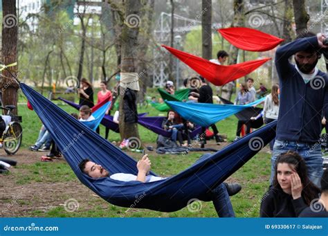 Young People Relaxing In Hammocks In The Park Editorial Photography