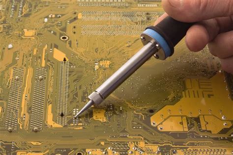 Soldering a circuit board — Stock Photo © Ohotnik #4623448