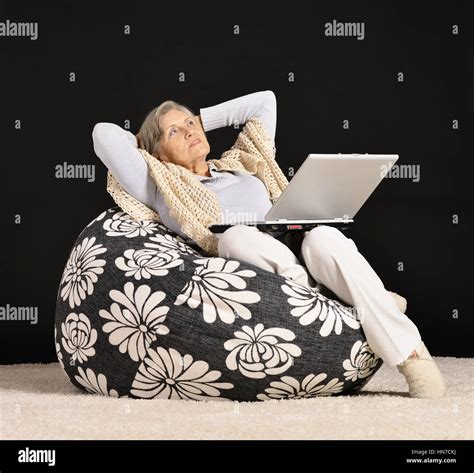 Mature Woman Relaxing With Laptop Stock Photo Alamy