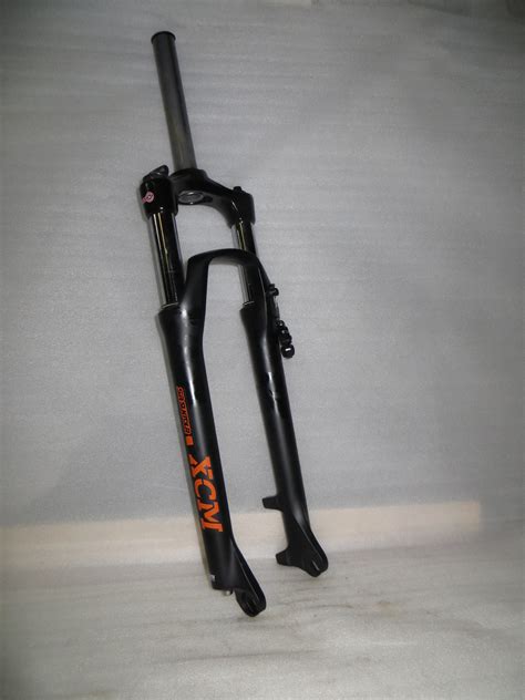 Вилка SUNTOUR XCM RL DS 29" 100мм блокировка на руле – купить за 6 500 ...