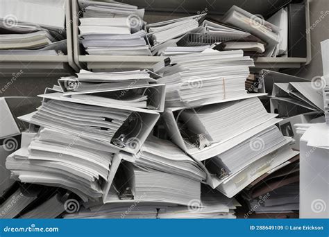 Messy Office Pile Of Binders With Papers Filing Disorganized Mess Stock