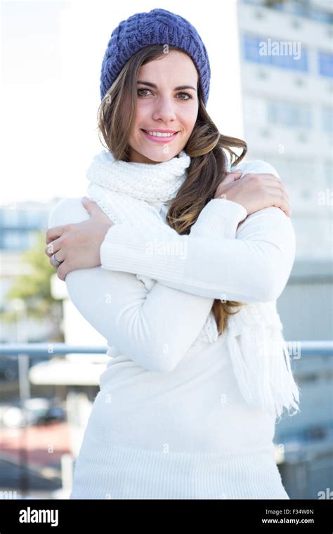 Cold Brunette In Warm Clothes Looking At Camera Stock Photo Alamy