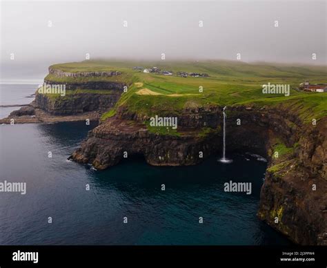 Beautiful Aerial View Of Gasadalur Waterfall And Village And Landscapes