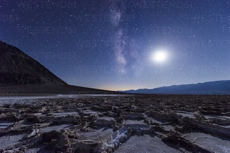 USA, California, Death Valley, Milky way and the moon over Badwater Basin stock photo