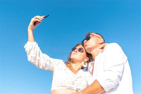 Young Happy Couple Taking Selfie On The Beach Summer Vacations Concept