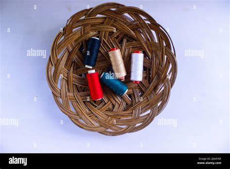 Sewing Thread Spool Of Thread With A Needle In Basket Isolated On