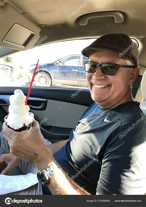 handsome man eating ice cream stock photo  lmel