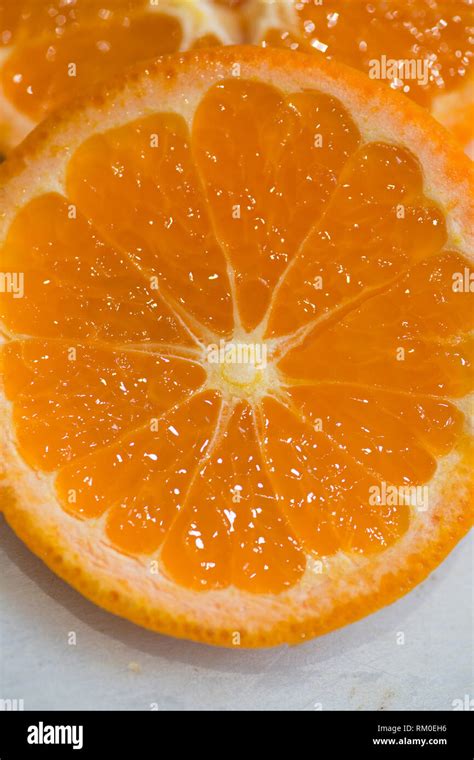 Freshly Sliced Oranges On A Chopping Board Showing The Juicy Fruit