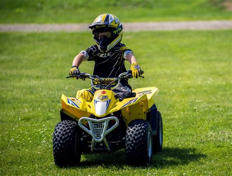 Small Child On Four Wheeler Editorial Photo Image Of Child Wheel