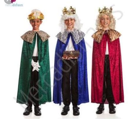 Three Men Dressed In Costumes With Crowns On Their Heads And One Man