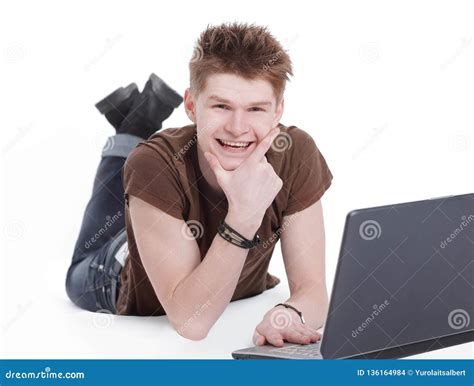 Closeup Modern Guy Working On Laptop Lying On The Floor Stock Photo