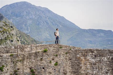 Man Tourist Walks Through The Old Town Of Bar In Montenegro Happy