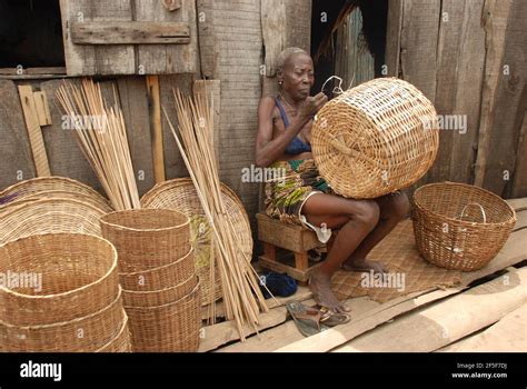 Nigerian Woman Weaving Baskets In The Outskirt Of Lagos State Nigeria