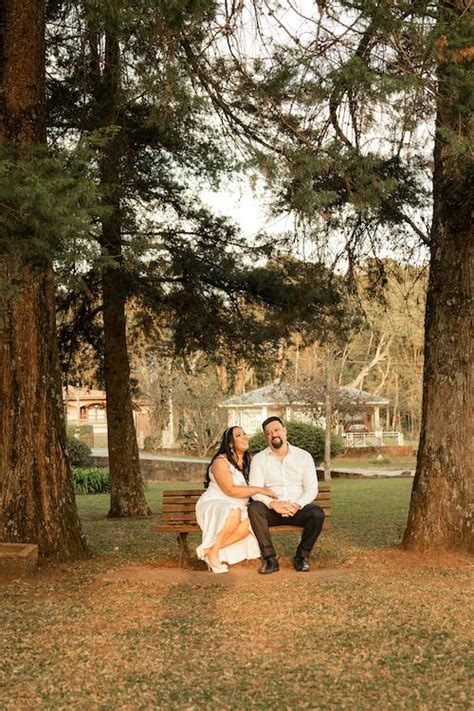 Lovely Couple Sitting on Wooden Park Bench · Free Stock Photo