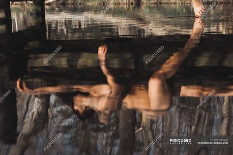 Nude Lady Lying On Wooden Pier And Touching Water By Leg In Autumn Forest Female Gorgeous