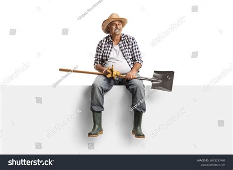 Cheerful Mature Farmer Sitting On Blank Stock Photo 2053733405
