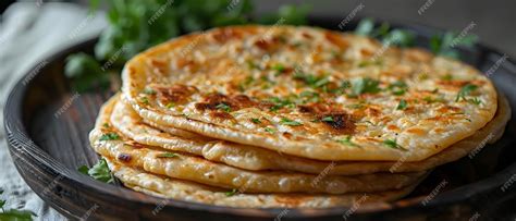 Premium Photo Photo Of Aloo Paratha On A Plain White Surface Concept