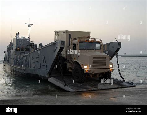 Us Navy Vehicles Are Offloaded From A Landing Craft Utility Lcu