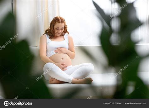 Pregnant Woman Touching Her Belly Stock Photo AlexLipa 161358944