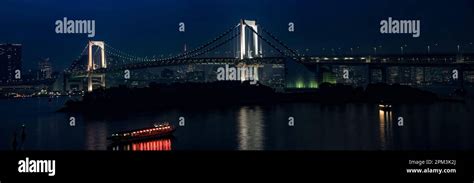 The Rainbow Bridge Is A Suspension Bridge Crossing Tokyo Bay Between