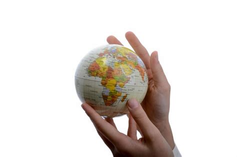 Premium Photo Cropped Hands Holding Globe Against White Background