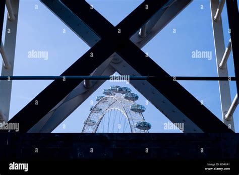 London eye through hungerford bridge, London Stock Photo - Alamy