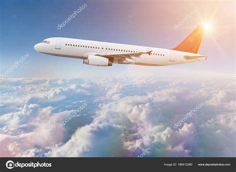 Commercial airplane flying above clouds. — Stock Photo © Kesu01 #189412260