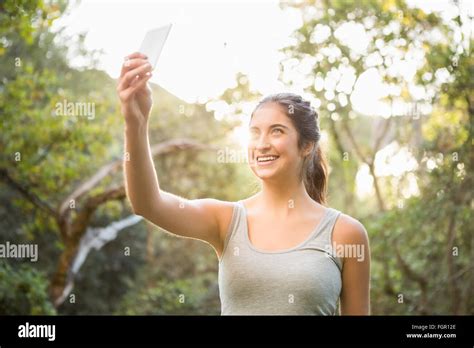 Smiling Athletic Brunette Taking Selfies Stock Photo Alamy