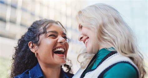 Happy Woman And Friends Laughing Outside In City Together Bonding And