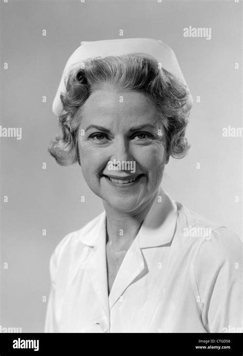 1960s Portrait Of Woman Nurse Smiling Wearing White Cap And Uniform