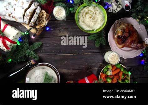 Festive Christmas Dinner Table With Traditional Foods And Dished Baked