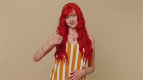 Redheaded Woman Raises Thumbs Up Agrees Or Gives Positive Reply