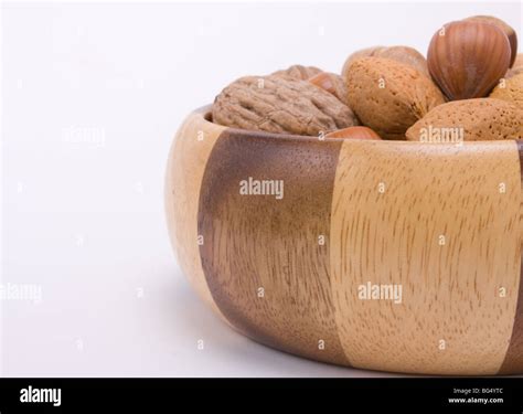 Wooden Bowl Filled With Mixed Nuts In Their Shells Hazelnuts Walnuts