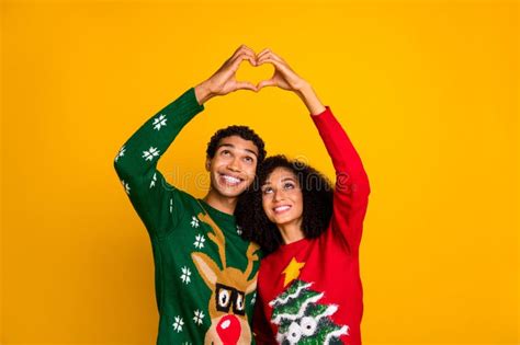 Portrait Of Peaceful Idyllic Partners Touch Arms Showing Heart Gesture