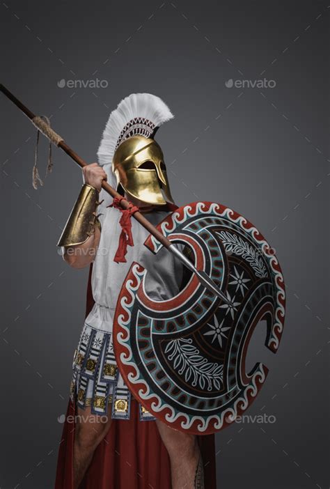 Glorious greek warrior with spear and rounded shield Stock Photo by ...