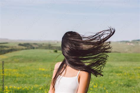 Woman Portrait When The Wind Blow Her Hair Covering Her Face Stock