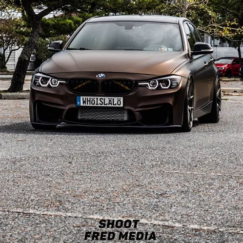 A Brown Car Is Parked On The Street