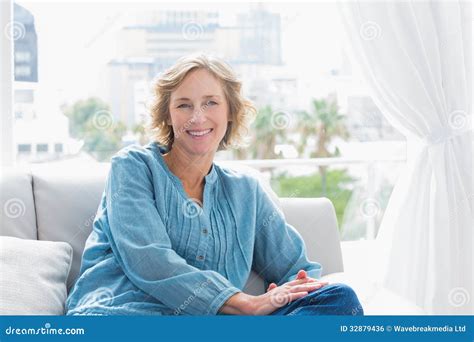 Content Blonde Woman Sitting On Her Couch Stock Photo Image Of Home Abode 32879436